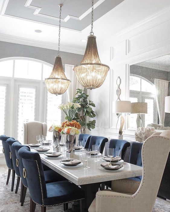 elegant dining room with double chandelier over dining table