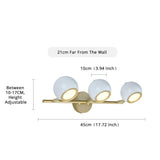 dimensions white and gold triple vanity sconce with white subway tile backsplash