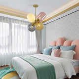 teen room decor with multi light chandelier with white pink gold amber and green decor