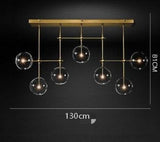 Linear brass 7 light chandelier for long dining table