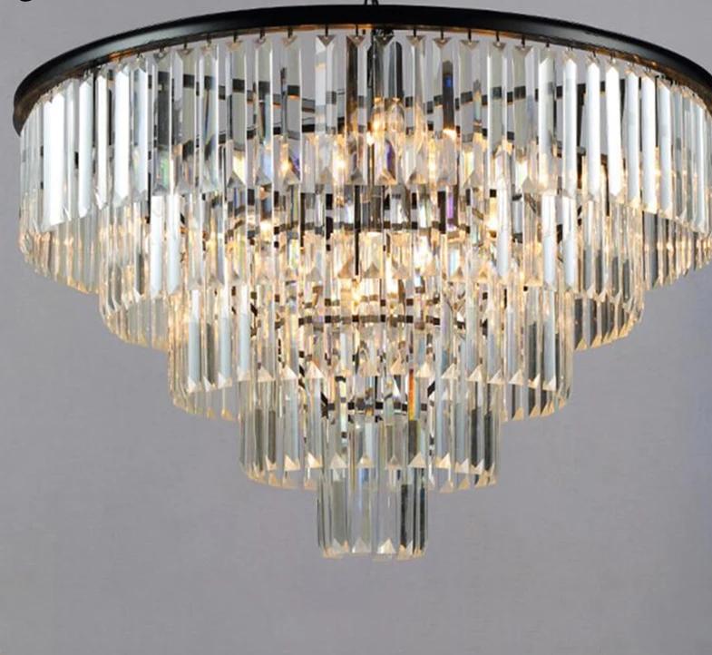 Tiered crystal chandelier hung at the right height over a dining table