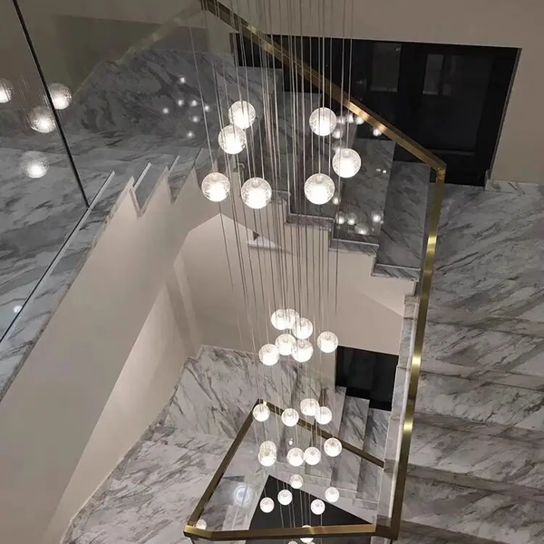 crystal ball cascade chandelier in a marble staircase