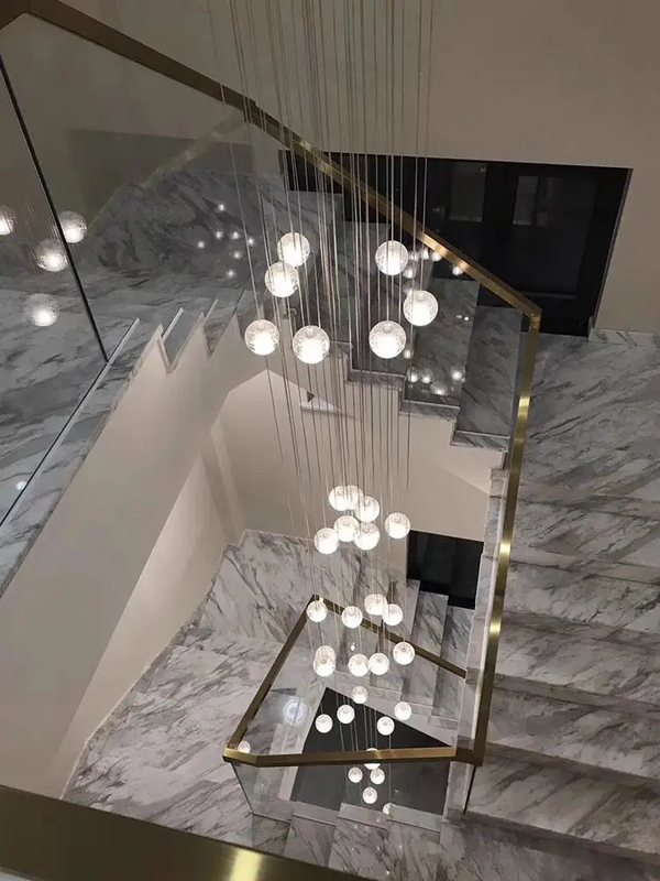 crystal ball cascade chandelier in a marble staircase