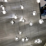 crystal ball cascade chandelier installed in a hallway