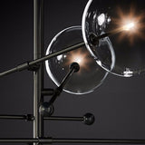 close up black 8 head hand blown mobile branching chandelier 