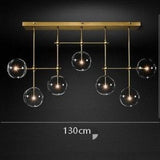 Linear brass 7 light chandelier for long dining table
