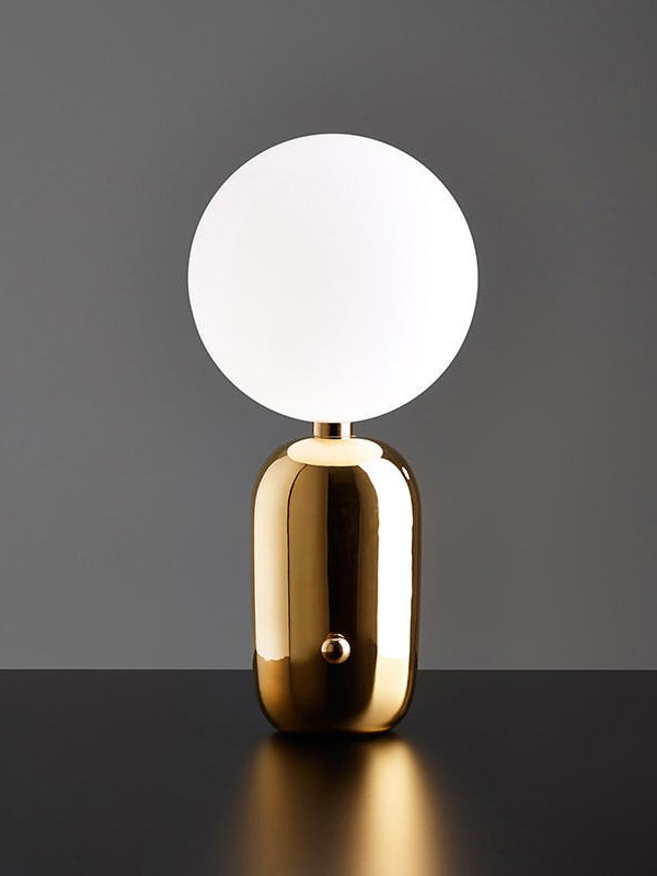 gold or black table lamp modernist-industrial appeal.