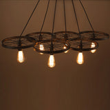 black iron bicycle wheel chandelier with edison bulb